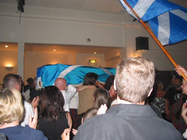 The coffin being carried out