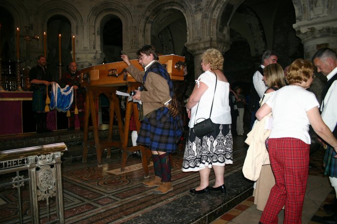 People placing their tributes in the coffin