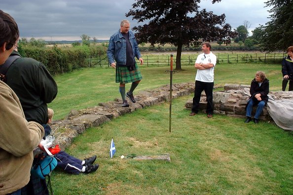 David talks about Wallace at Cambuskenneth Abbey, 13 September 2003, with the Wallace Stone in the foreground