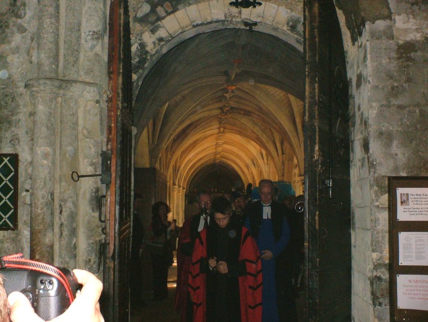 The coffin leaves the side chapel